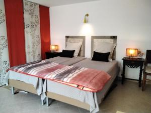 a bedroom with a large bed with two lamps at Manta Rota Beach, apartment in a villa, terrace,garden in Manta Rota