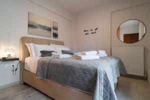 A bed or beds in a room at Diamond Palace Trikala