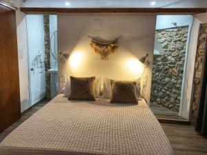 מיטה או מיטות בחדר ב-Casa TERRAE Casco antiguo WifiAA