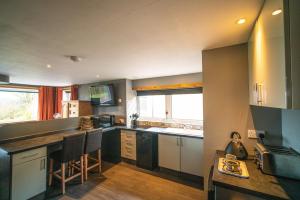 a kitchen with a sink and a counter top at The Pig Shed Self Catering in Wick
