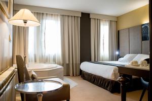 Voodi või voodid majutusasutuse Costa Esmeralda Suites toas