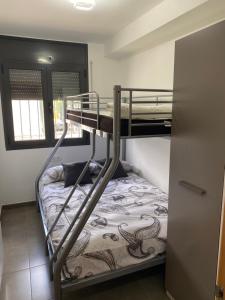 Katil atau katil-katil dalam bilik di Ample house with views in front of Baells reservoir