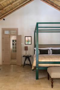 A bed or beds in a room at Halcyon Mawella