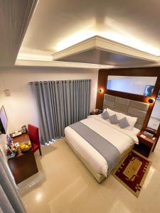 Tempat tidur dalam kamar di Nascent Gardenia Residence