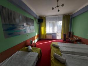 Postel nebo postele na pokoji v ubytování Rezydencja Izabella + 37 fotografií