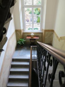 a stairway with a window and a stair case at Villa Crochat in Como