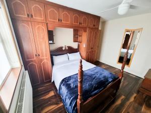 A bed or beds in a room at 3 Bed Renovated Cottage Carramore Lake, Belmullet