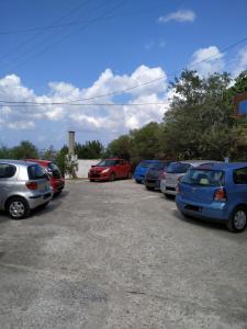 a row of cars parked in a parking lot at Silver view in Batsi