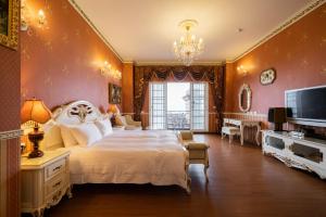 Voodi või voodid majutusasutuse Cingjing Florence Resort Villa toas
