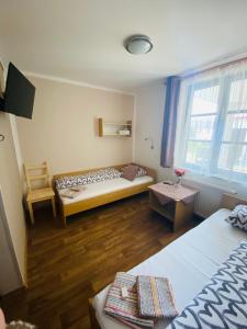 Letto o letti in una camera di Hotel Pod Zámkem