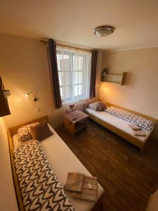 Postel nebo postele na pokoji v ubytování Hotel Pod Zámkem