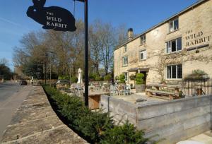 a sign for the wild park in front of a building at Church Cottage in Chipping Norton