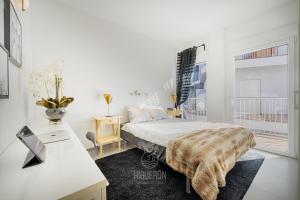 Posteľ alebo postele v izbe v ubytovaní HigueronRentals Gucci
