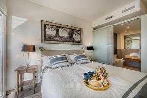 Posteľ alebo postele v izbe v ubytovaní HigueronRentals Gucci