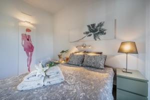 Posteľ alebo postele v izbe v ubytovaní HigueronRentals Gucci