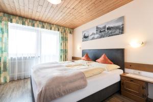 Letto o letti in una camera di Gasthof Pension Berghof