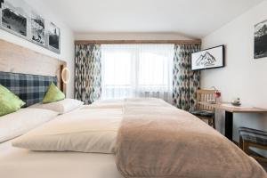 Letto o letti in una camera di Gasthof Pension Berghof