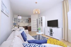 Kuchyňa alebo kuchynka v ubytovaní Victus Apartamenty, Apartament Family&Friends