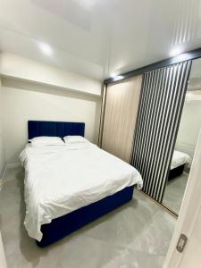 מיטה או מיטות בחדר ב-GSS - A Apartment