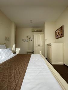 Кровать или кровати в номере Гостиница Мономах