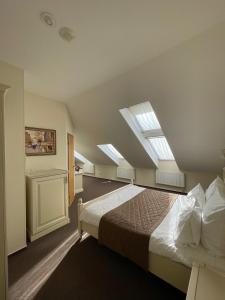 Кровать или кровати в номере Гостиница Мономах
