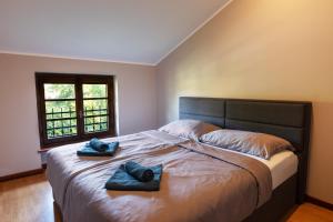 Postel nebo postele na pokoji v ubytování Doppelhaus Villa Casa Alpe Adria