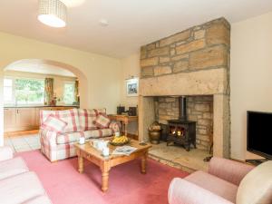 Posezení v ubytování Dorothy's Cottage