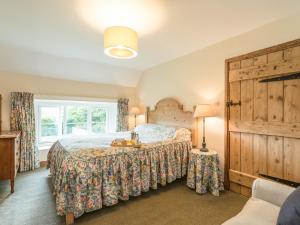 Postel nebo postele na pokoji v ubytování Dorothy's Cottage