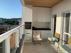 Ein Balkon oder eine Terrasse in der Unterkunft MORAMAR - PRAIA Das TONINHAS