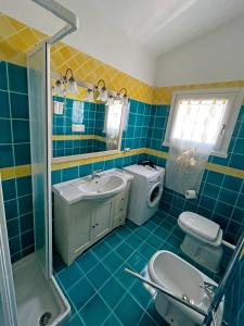 Et badeværelse på Appartamenti Residence Zodiaco