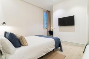 Voodi või voodid majutusasutuse Prado Rooms 46 - Darya Living toas