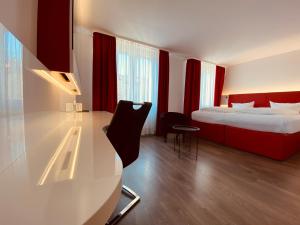 Postel nebo postele na pokoji v ubytování DORMERO Hotel Dresden City