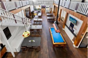 an overhead view of a lobby with tables and chairs at Kearsley Hotel in Cessnock