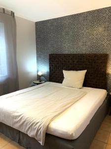 Postel nebo postele na pokoji v ubytování Hotel Borchers