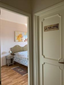 a door leading to a bedroom with a bed at B&B EurGardenie in Rome