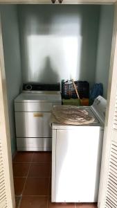 a small kitchen with a stove and a counter top at Brenda alicia in Puerto Peñasco