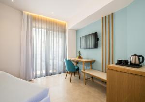 TV a/nebo společenská místnost v ubytování M City Hotel
