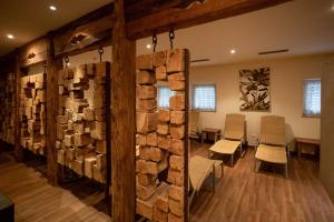 a room with a stack of fire wood at Hotel Martinerhof in San Lorenzo di Sebato