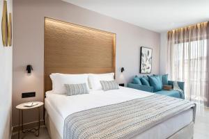 Postel nebo postele na pokoji v ubytování M City Hotel