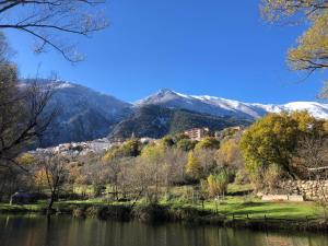 a view of a river with mountains in the background at Romantic Yurt in Nature Reserve with Jacuzzi in Anversa degli Abruzzi