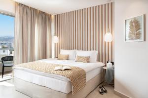 Postel nebo postele na pokoji v ubytování M City Hotel
