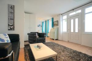 Posezení v ubytování Ferienwohnung Kajüte am Borbyer Kurpark von Eckernförde