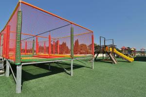 a batting cage on a playground with at HOTEL BARONE DI MARE in Torre dell'Orso