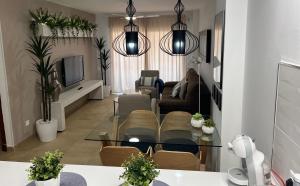 Telewizja i/lub zestaw kina domowego w obiekcie Apartamento Nemingzhen Tarifa
