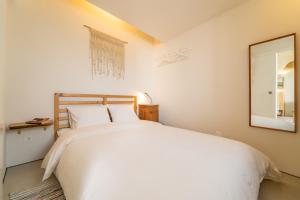 Postel nebo postele na pokoji v ubytování Casinha do Burro, Casas do Poente, Rogil, Aljezur