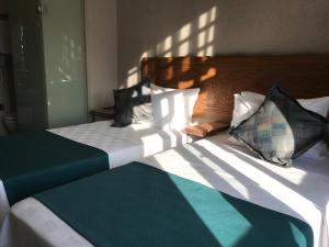 A bed or beds in a room at GALATAHAN Hotel Istanbul Karakoy