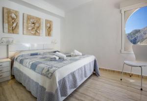 A bed or beds in a room at Apartamentos President 3ºD
