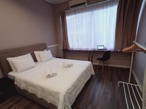 Postel nebo postele na pokoji v ubytování Ermou & Athinas Suites in Monastiraki