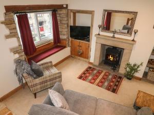 an overhead view of a living room with a fireplace at Cobble Cottage in Burton in Lonsdale