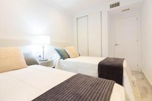 Posteľ alebo postele v izbe v ubytovaní Atarazanas FreshApartments